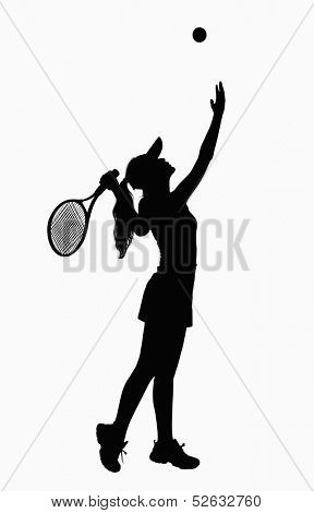 Silhouette of woman seving with tennis racket