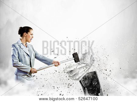 Image of businesswoman crushing with hammer pile of keyboards