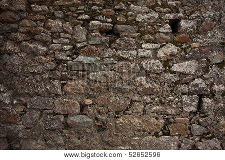 Black Old Wall Was Built Of Stones