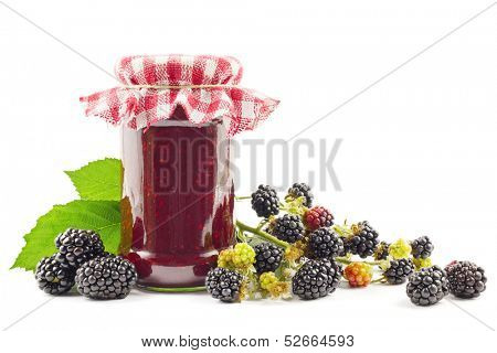 Jar with blackberry jam with fresh blackberries on white