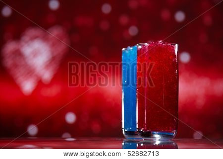 slush ice in glasses, red and blue on glitter star background