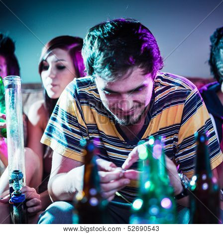 young man at party doing drugs