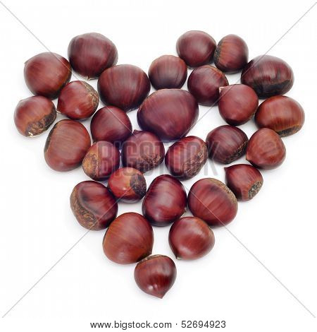 a pile of chestnuts forming a heart on a white background