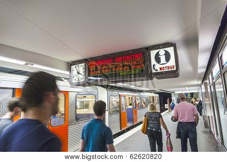People In The Metro Station With Train In Motion