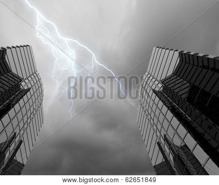 Bottom image of skyscraper with thunder lightning in sky