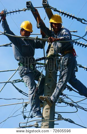 Asian Electrician Climb High, Work On Electric Pole