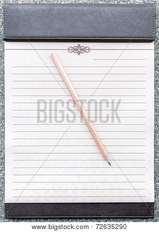 Blank Notepad With Pencil On The Brown Clipboard.