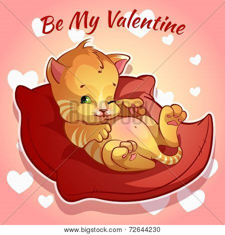 Cute ginger kitten on a red cushion
