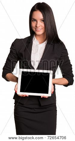Beautiful businesswomen in suit showing tablet pc