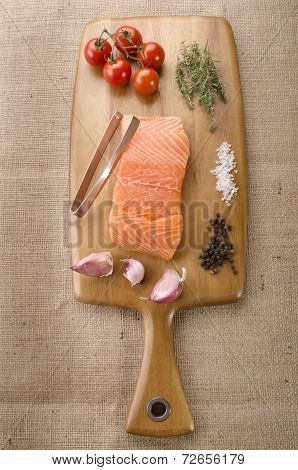 Fresh Salmon Fillet On Wooden Board