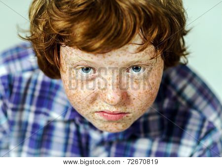 Emotional Portrait Of Red-haired Boy
