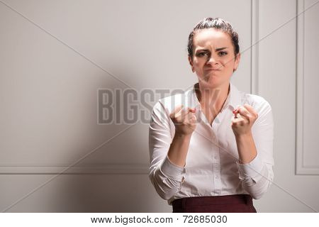 Serious woman wearing white blouse