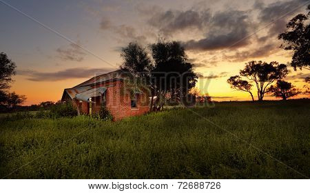 Abandoned Farm House At Sunset