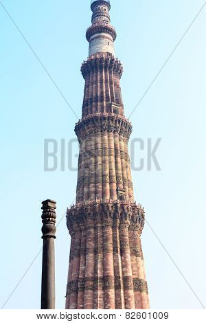 Qutb Minar tower with Iron pillar in New Delhi, India