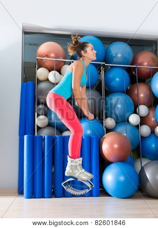 Kangaroo jumps anti gravity fitness boots girl at gym indoor