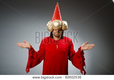 Funny wizard wearing red dress