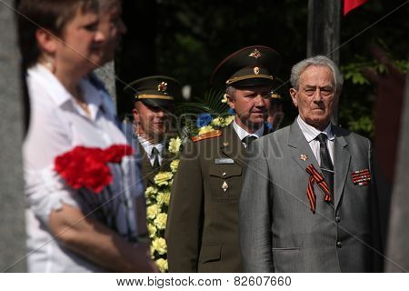 PRAGUE, CZECH REPUBLIC - MAY 9, 2013: Soviet war veterans attend the celebration of Victory Day at the Soviet War Memorial at the Olsany Cemetery in Prague, Czech Republic.