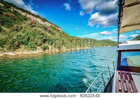 Traveling With A Boat On The Sea. Sunny Day With Clouds.