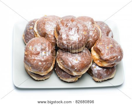 Polish donuts on plate shot on white                               