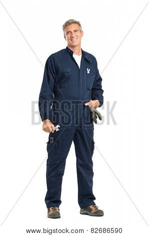 Portrait Of Confident Mature Mechanic With Wrench Looking At Camera Standing Isolated On White Background