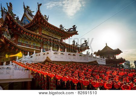 KUALA LUMPUR, MALAYSIA - FEBRUARY 08, 2015: Tourists visit the scenic Thean Hou Temple with hundreds of lanterns hung across the courtyard. This is in preparation for the coming Chinese New Year.