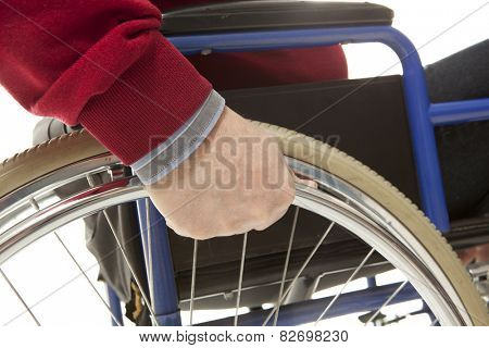 Wheelchair user makes various movements with his wheelchair, exercises for safety handling