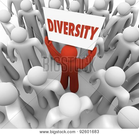 Divsersity word on a sign held by a different or unique person in a crowd