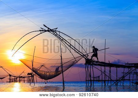 Sunset At Tropical Beach With Thailand Fishing Nets