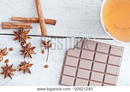 Cinnamon Stick, Star Anise, Bar Of Chocolate And Cup Of Tea