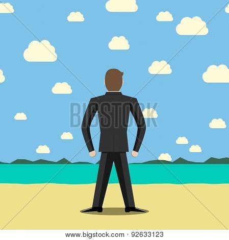 Businessman Standing On Beach