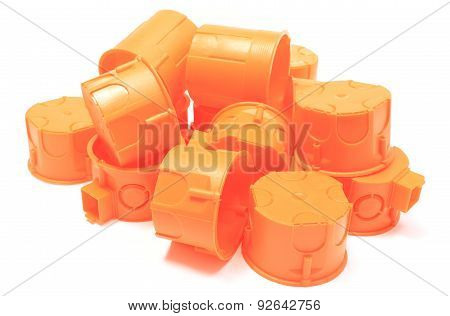Heap Of Orange Electrical Boxes On White Background