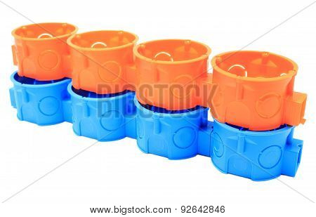 Stack Of Orange And Blue Electrical Boxes. White Background
