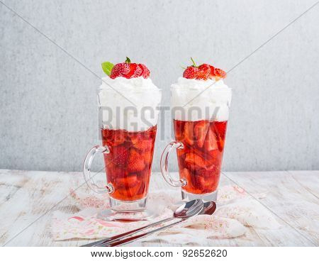 Strawberries In Jelly Topped With Whipped Cream