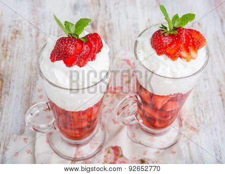Strawberries In Jelly Topped With Whipped Cream