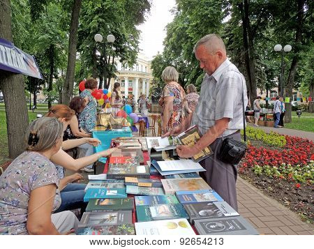 Men Chooses Books To Buy Them