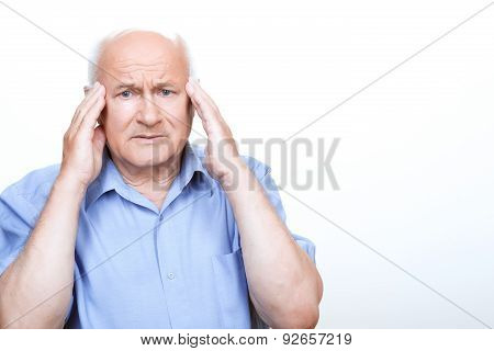 Anxious grandfather touching his head