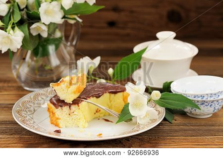 Homemade Baked Pudding With Chololate Icing, Jasmine Flowers And Chinese Teaware