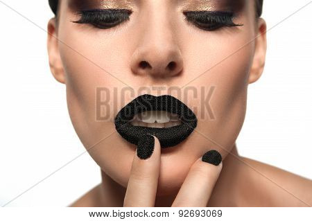 Beauty Fashion Model With Black Caviar On His Lips And Nails