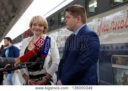 ST. PETERSBURG, RUSSIA - MAY 28, 2016: Deputy director of JSC FPK Stanislav Zotin (right) and President of the Mikhail Ulyanov's foundation Elena Ulyanova talk with press at the double-decker train