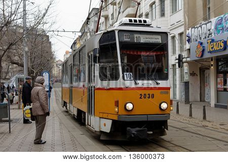 SOFIA, BULGARIA - MARCH 6, 2016: People at the tram in the city center. The tramway system in Sofia was created in 1901, and now is the only tramway system in Bulgaria