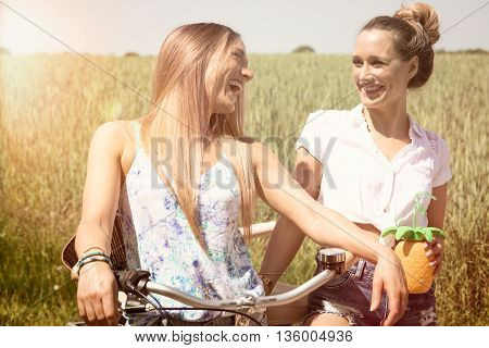 trendy twin girls making a bike tour. summerfeeling.