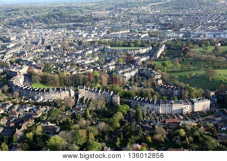 View of the City of Bath from a hot air balloon high overhead showing the extraordinary architecture and green spaces the palce has to offer.