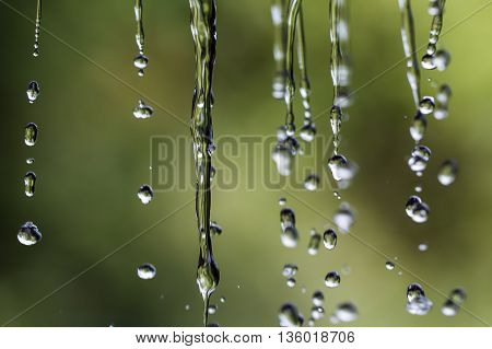 Raindrops on a rope for clothes on a blurred background.