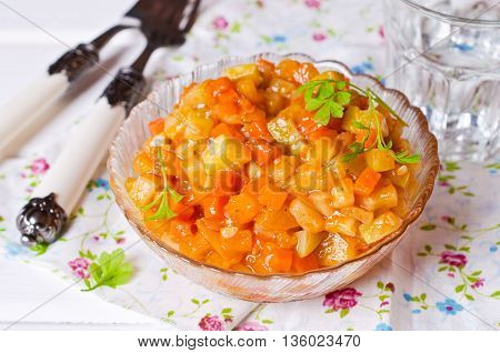 Vegetable stew with sauce on wooden background. Selective focus.