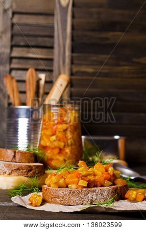 Open sandwich with steamed vegetables on a wooden background. Selective focus.