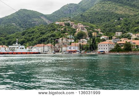 View on the coast from ferry transporting cars and people in Lepetane Tivat Montenegro