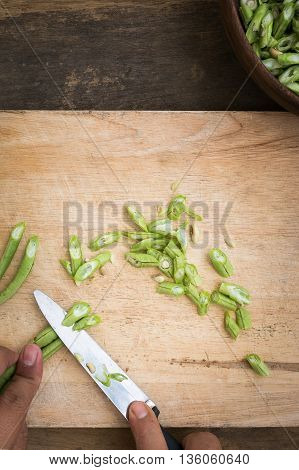 stil life yardlong bean slice on Chopping board wood.