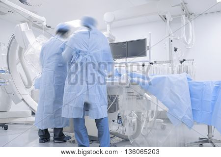 Doctors working in hospital cathlab. Professional work