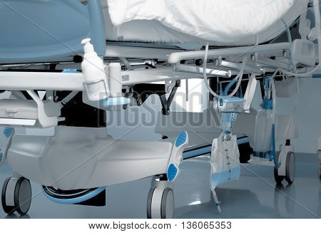 Urine collection bag in a modern ICU bed.