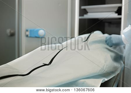 Corpse in the mortuary in the bag with a zipper.